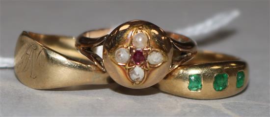 A 9ct gold signet ring and two other yellow metal and gem set rings.
